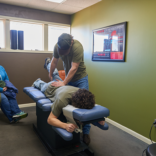 Dr. Aaron Zimmerman doing a Flexion-Distraction Therapy on male patient